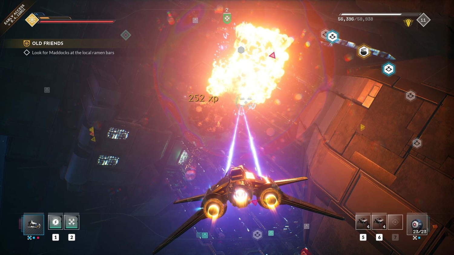 Spaceship firing two purple laser beams at a large fiery explosion inside a futuristic space station