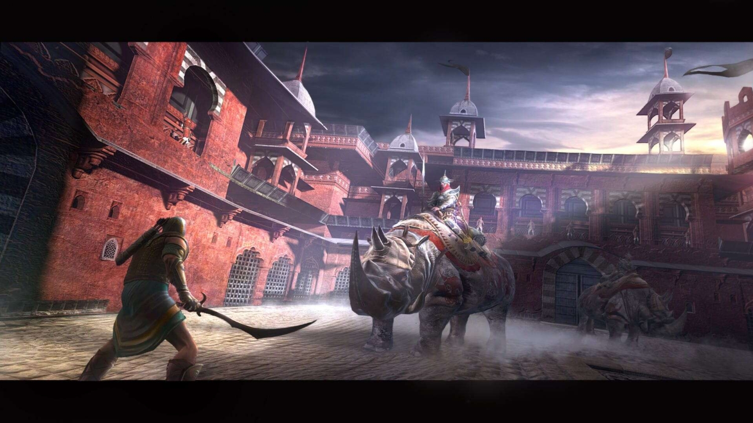Armoured warrior wielding curved sword confronts soldier mounted on a rhinoceros inside a large fortified arena at dusk