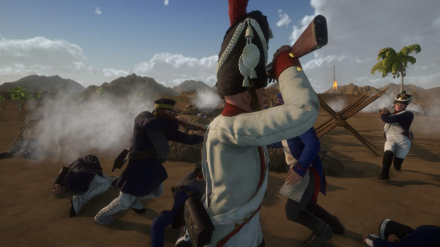 Soldiers in historical musketeer uniforms firing weapons amid smoke on a dry battlefield with mountains and palm trees