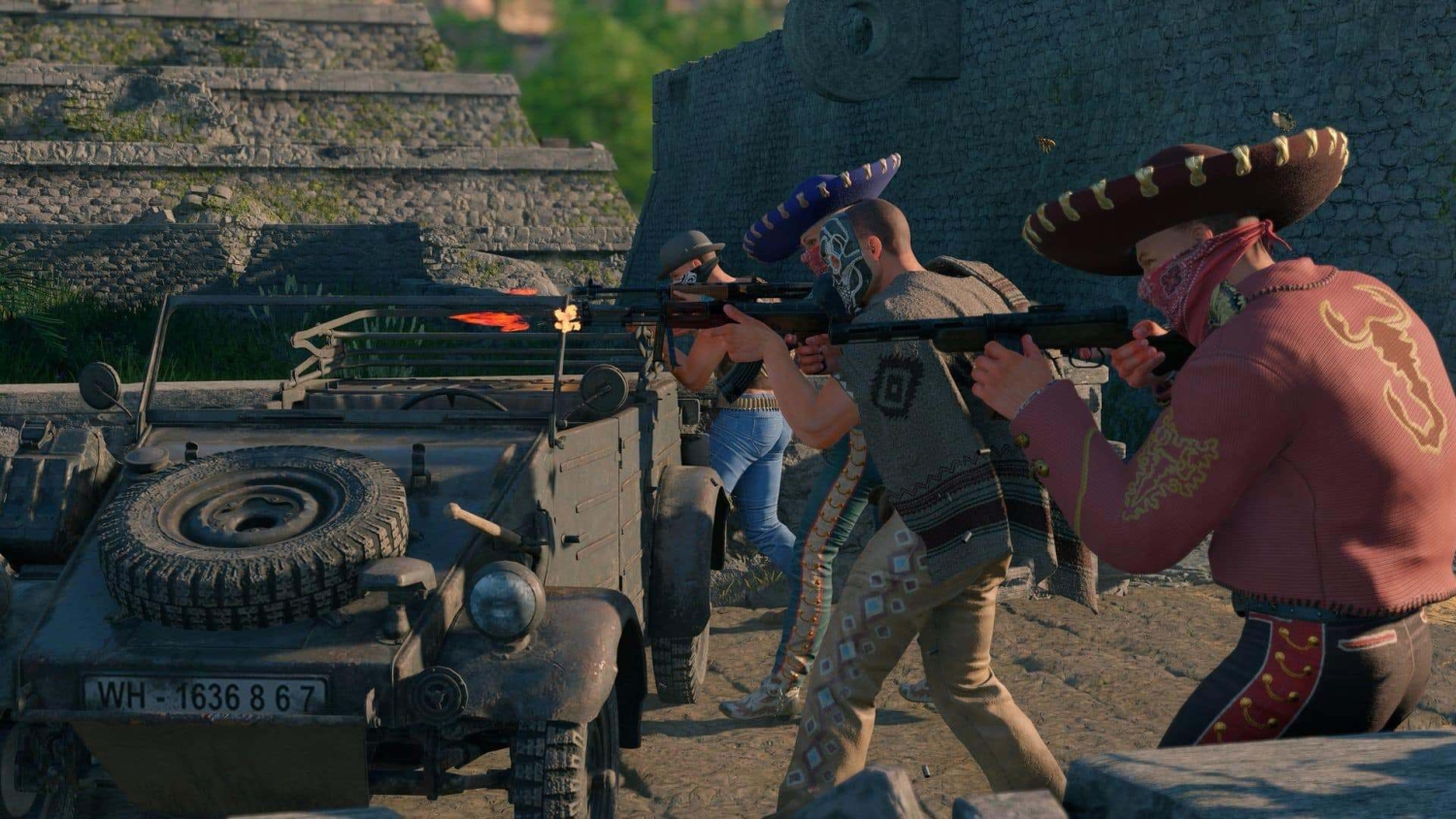 Four armed figures wearing colourful sombreros and masks firing rifles beside an old military vehicle near stone ruins
