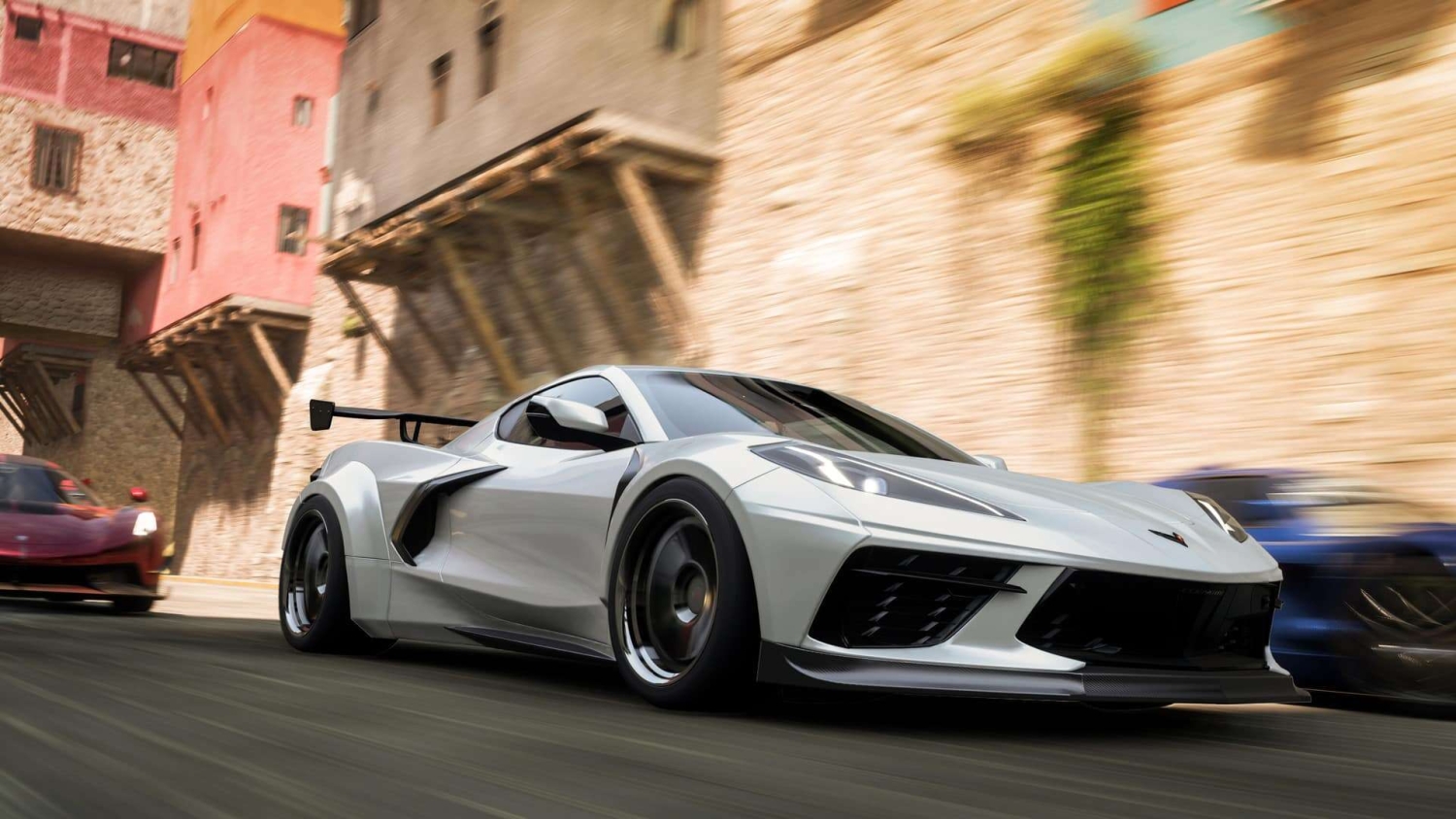 White sports car speeding past stone and pink buildings in a narrow city street race