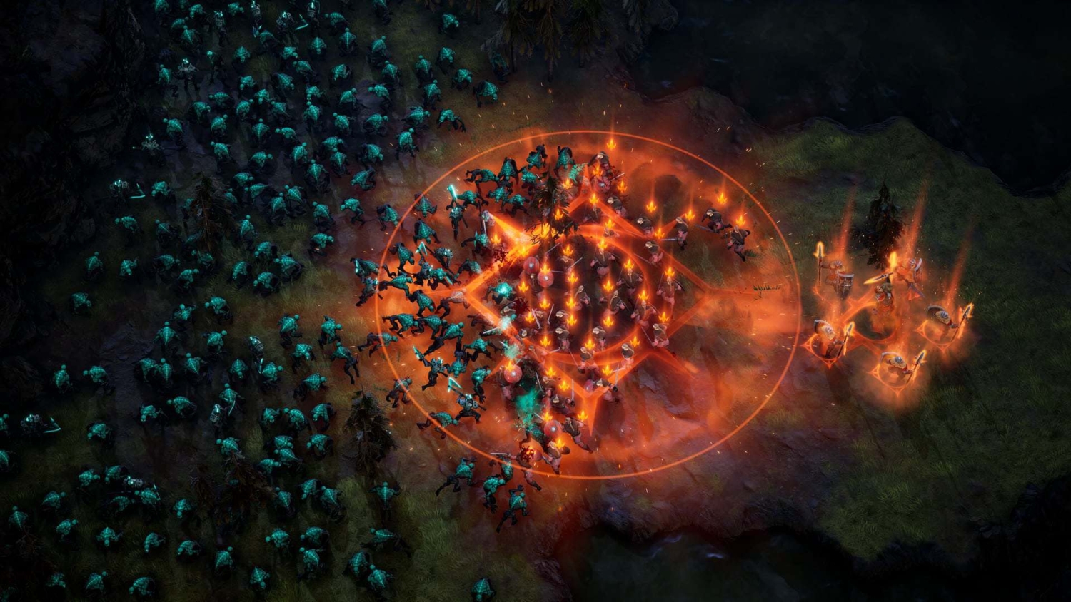 Large swarm of blue creatures attacking defenders glowing orange on dark forest ground