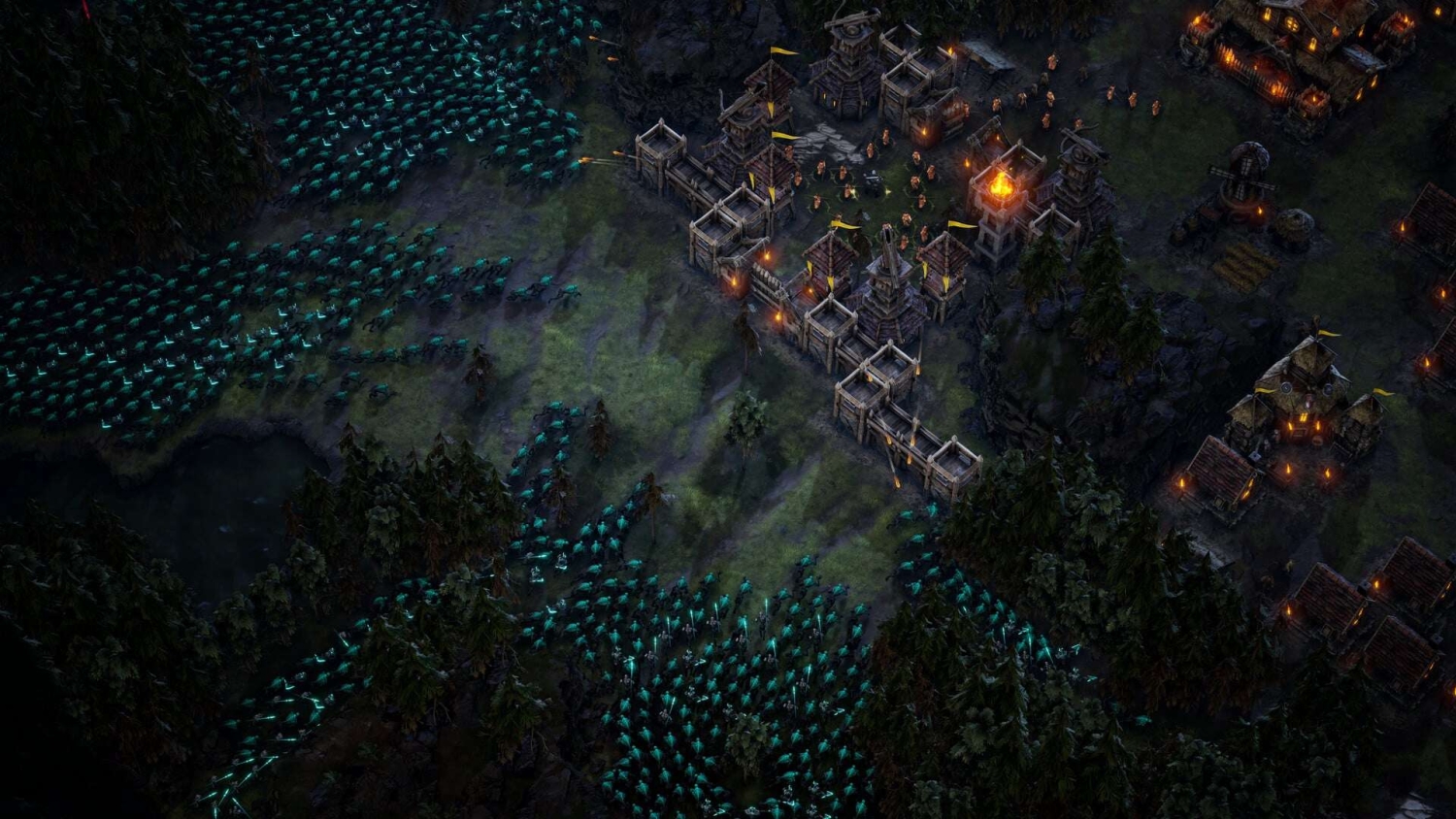 Numerous blue glowing creatures attack a well-defended village with wooden and stone walls at night