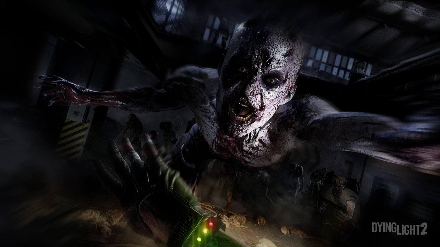 A close-up of a bloodied zombie lunging forward aggressively in a dark, abandoned industrial environment.