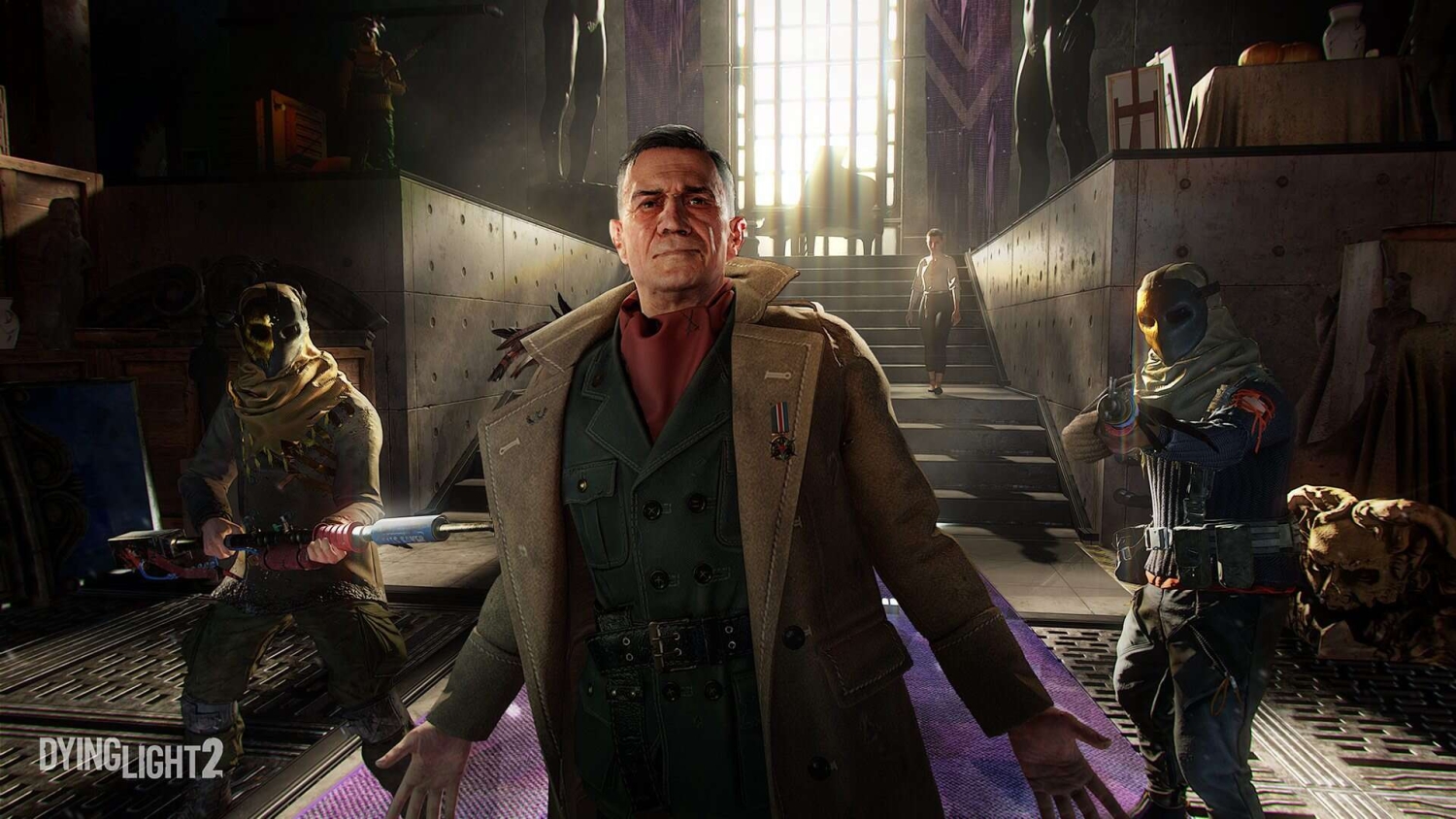 Man in military coat stands with arms open while two masked armed guards aim weapons in a dimly lit room