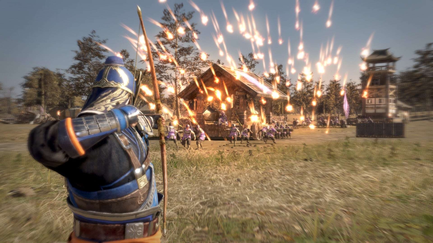 Armoured soldier in blue firing flaming arrows at wooden cart and running soldiers in a field