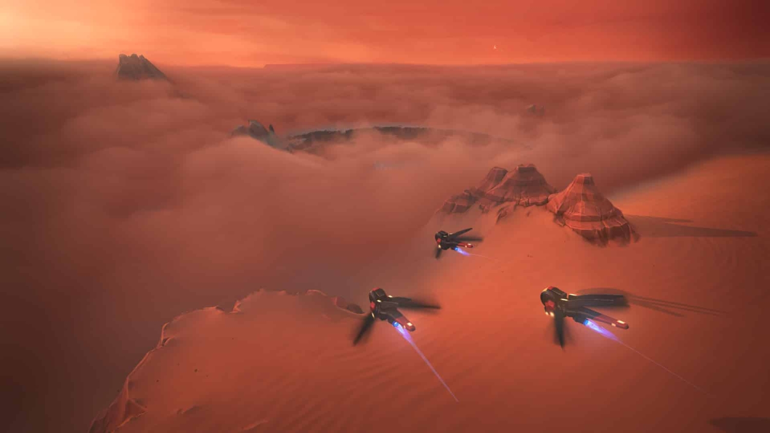 Three sleek futuristic aircraft emitting blue engine trails flying above a red desert landscape with fog at sunset