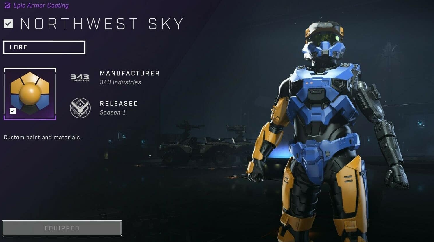 Armoured figure wearing blue and yellow custom paint named Northwest Sky in a dimly lit hangar