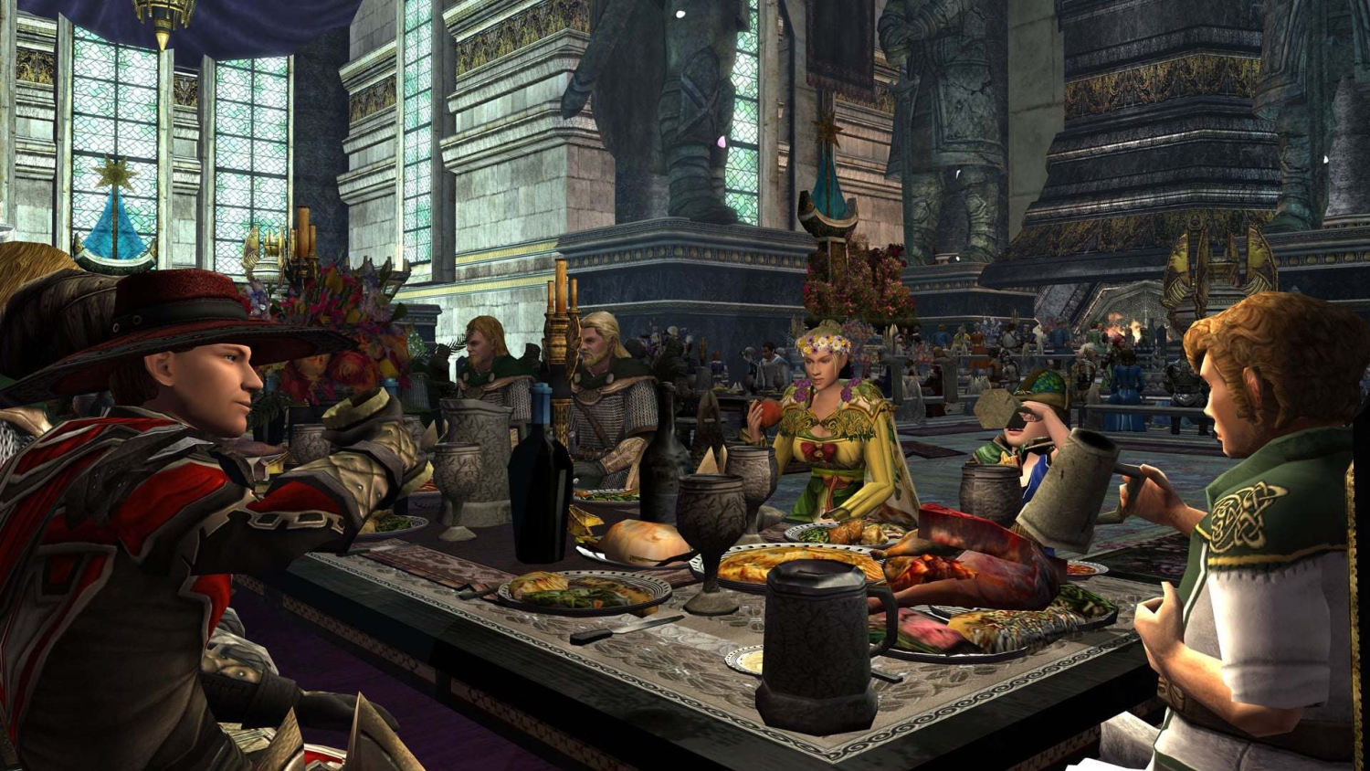 Characters in medieval clothing share a large feast around a table in a grand stone hall with stained glass windows and statues