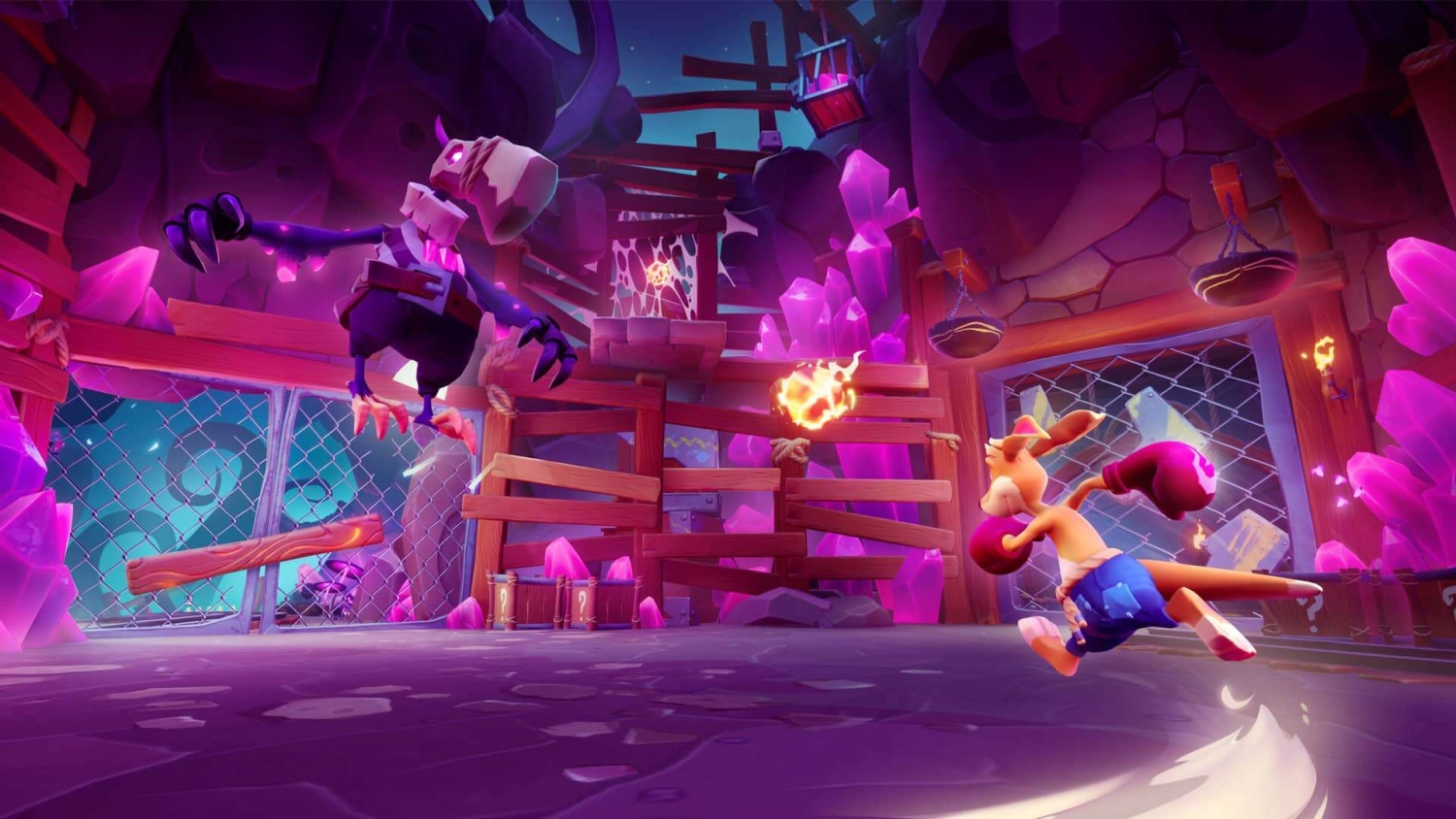 Orange kangaroo wearing blue shorts and purple boxing gloves attacks a skeletal enemy in a cave with vivid purple crystals