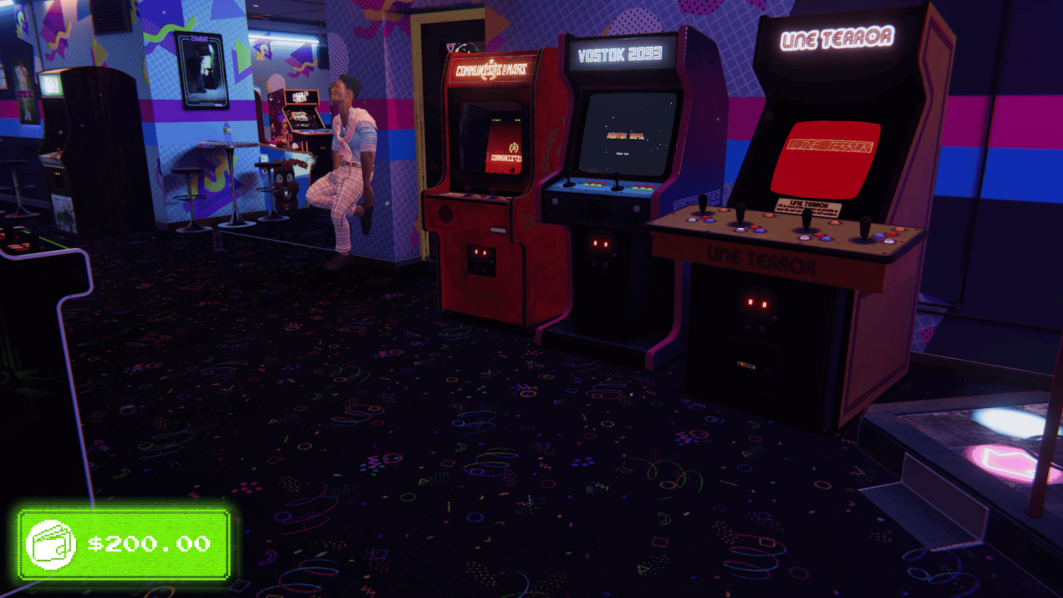 Colourful arcade room featuring several retro game cabinets and a person sitting against the wall