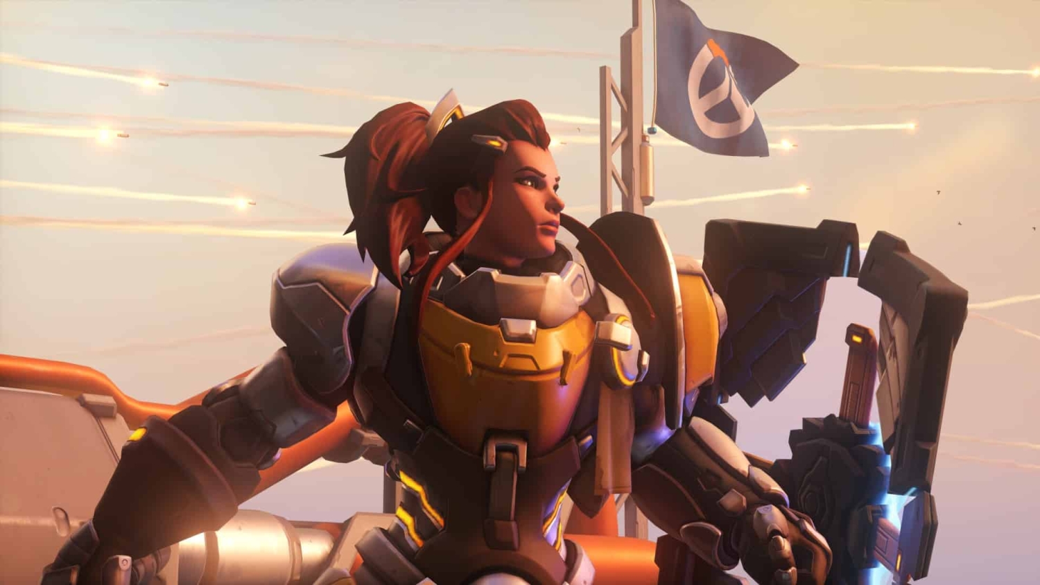 Armoured character with red hair and a mechanical arm gazing determinedly beside a waving flag during sunset