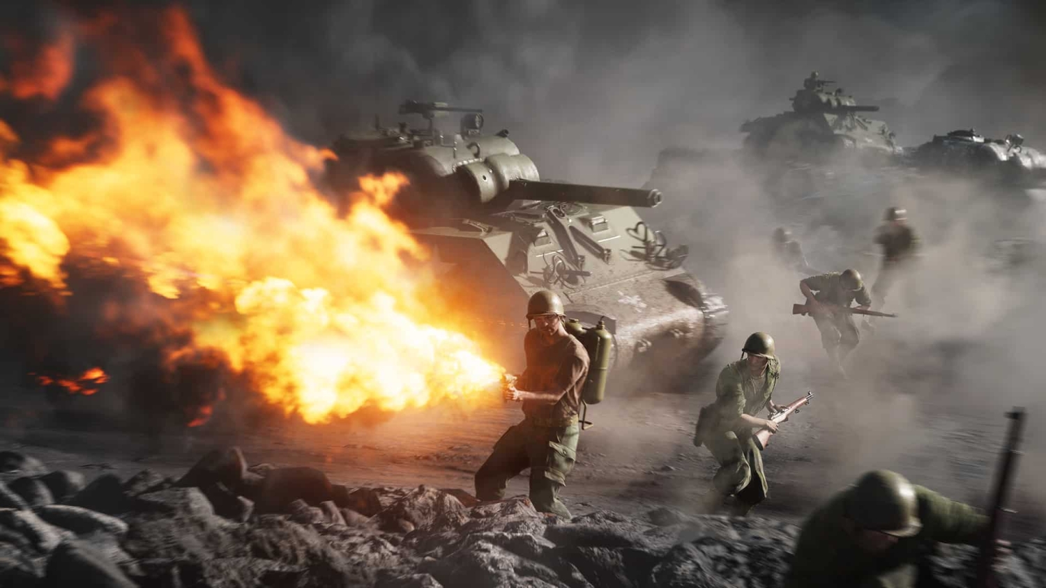 Soldiers advancing on rocky ground with a flamethrower and tanks in smoky, fiery battlefield
