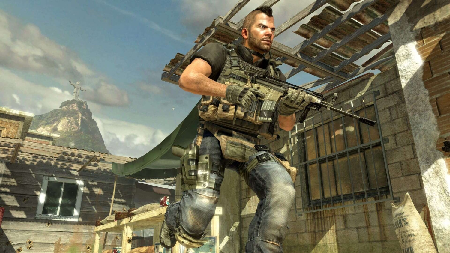 Armed soldier with tactical vest and gloves moving carefully through a sunlit courtyard with Christ the Redeemer statue visible in the background