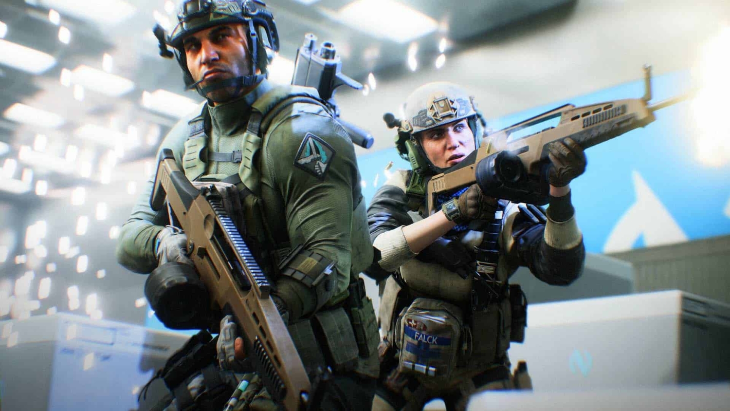 Two soldiers in modern tactical gear holding rifles in an illuminated indoor combat zone