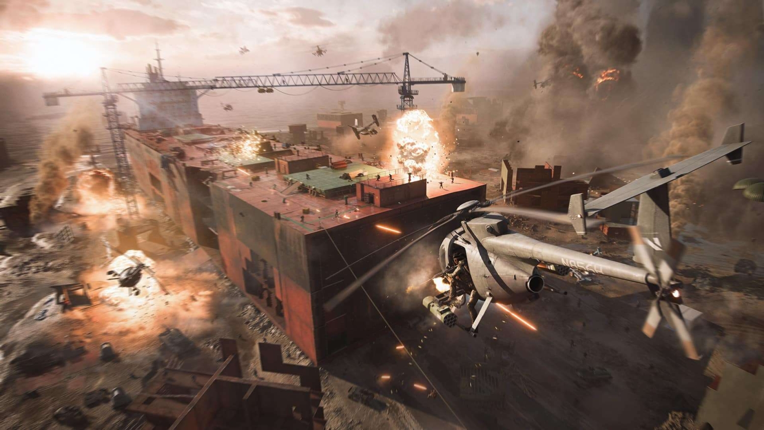 Combat helicopters firing on a large cargo ship amid explosions and dense smoke during intense battle