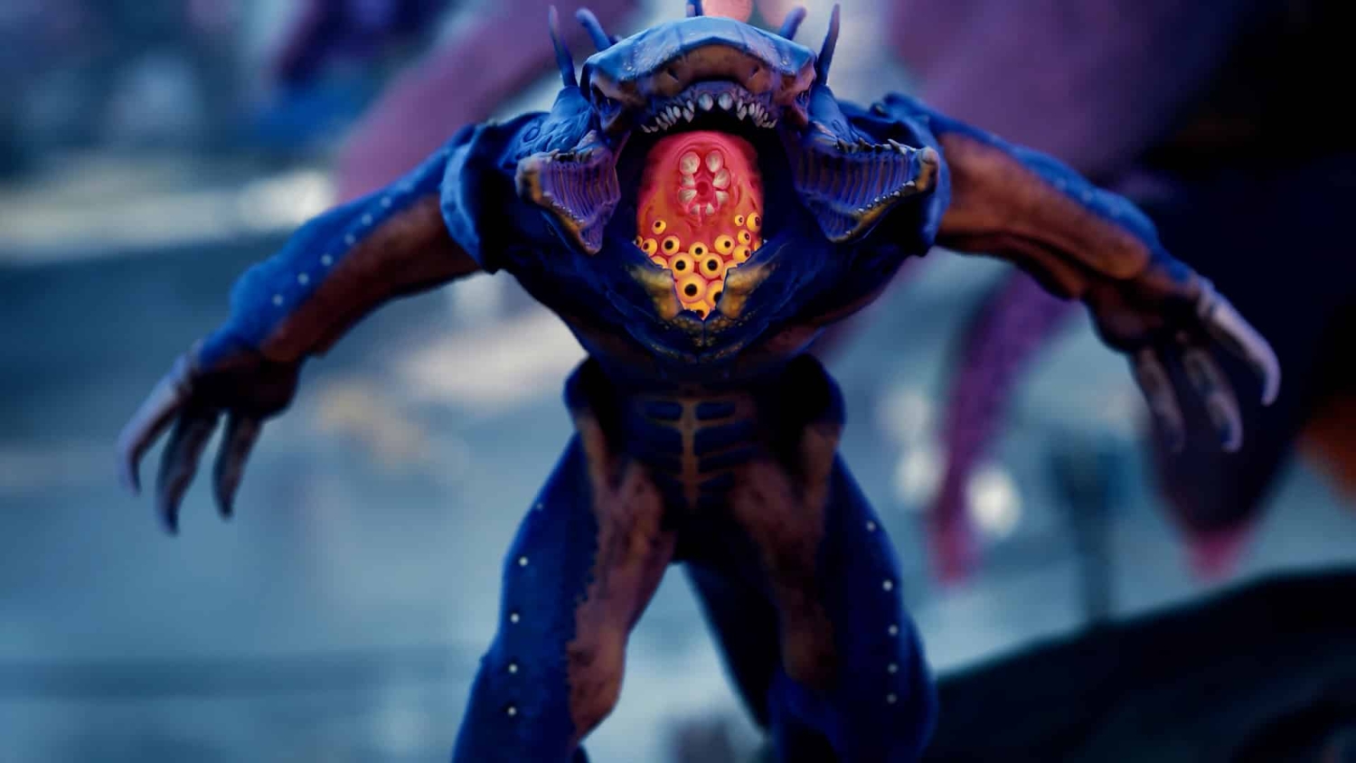 Blue alien creature with wide open mouth revealing multiple small yellow eyes inside a red interior