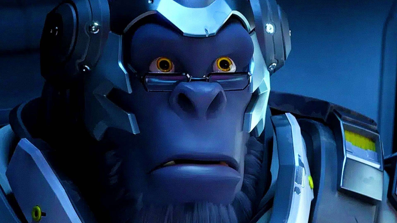 Close-up of a robotic gorilla with yellow eyes and glasses bathed in blue lighting
