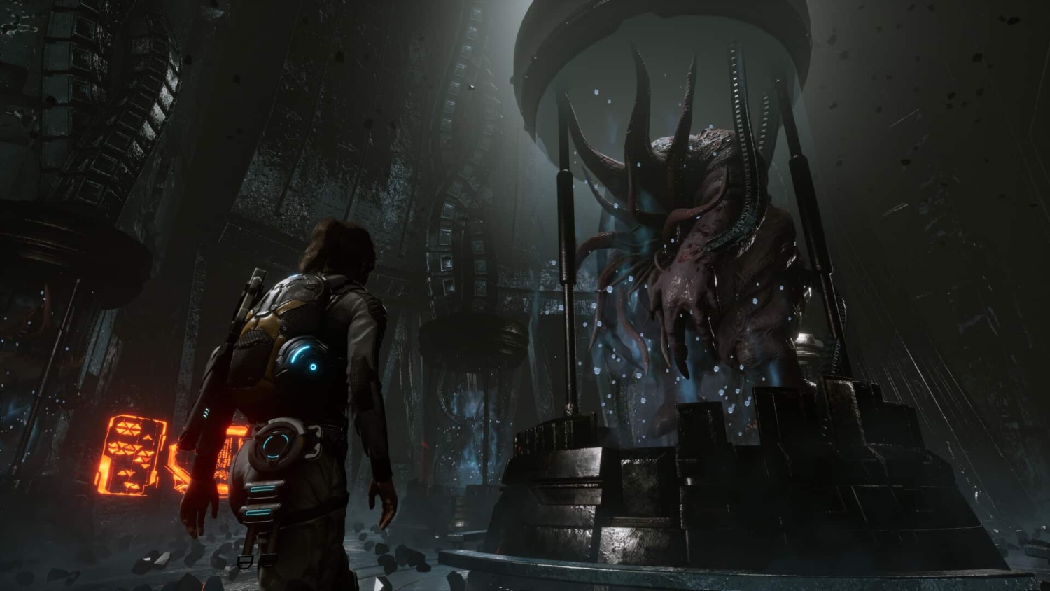 Person in futuristic suit stands before a large tentacled alien in a dark sci-fi chamber filled with debris and glowing panels