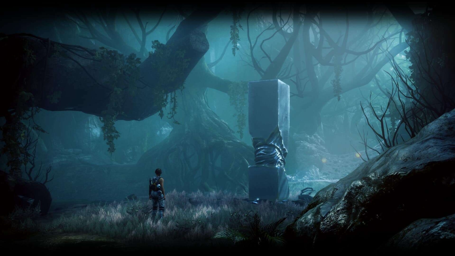 Person in futuristic gear standing in a foggy forest clearing facing a tall, smooth stone monument wrapped with metallic drapery