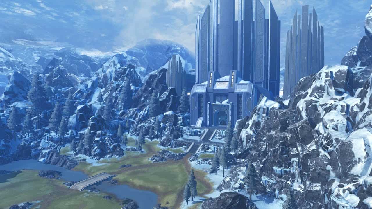 Large futuristic structure surrounded by snow-covered rocky mountains and pine trees with a small bridge over a river in the foreground