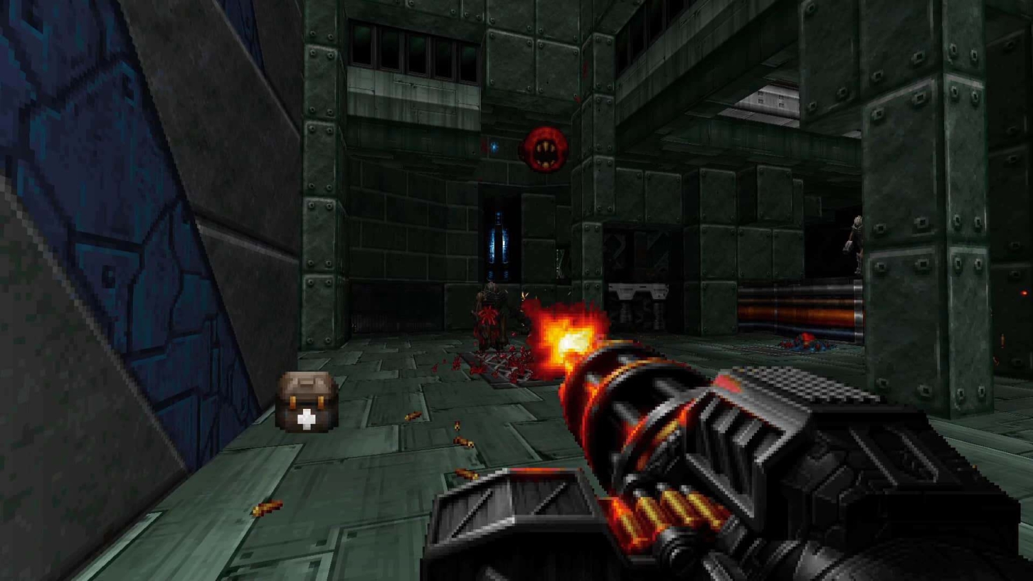 First-person view of firing a large machine gun in a dark industrial setting with pixelated enemies and ammo on the floor