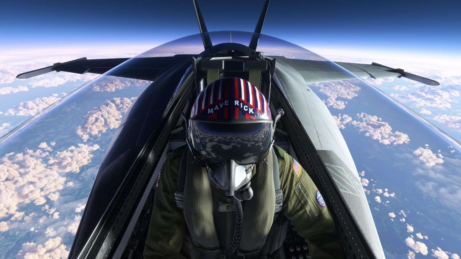Pilot wearing helmet and flight suit inside fighter jet cockpit above clouds with blue sky
