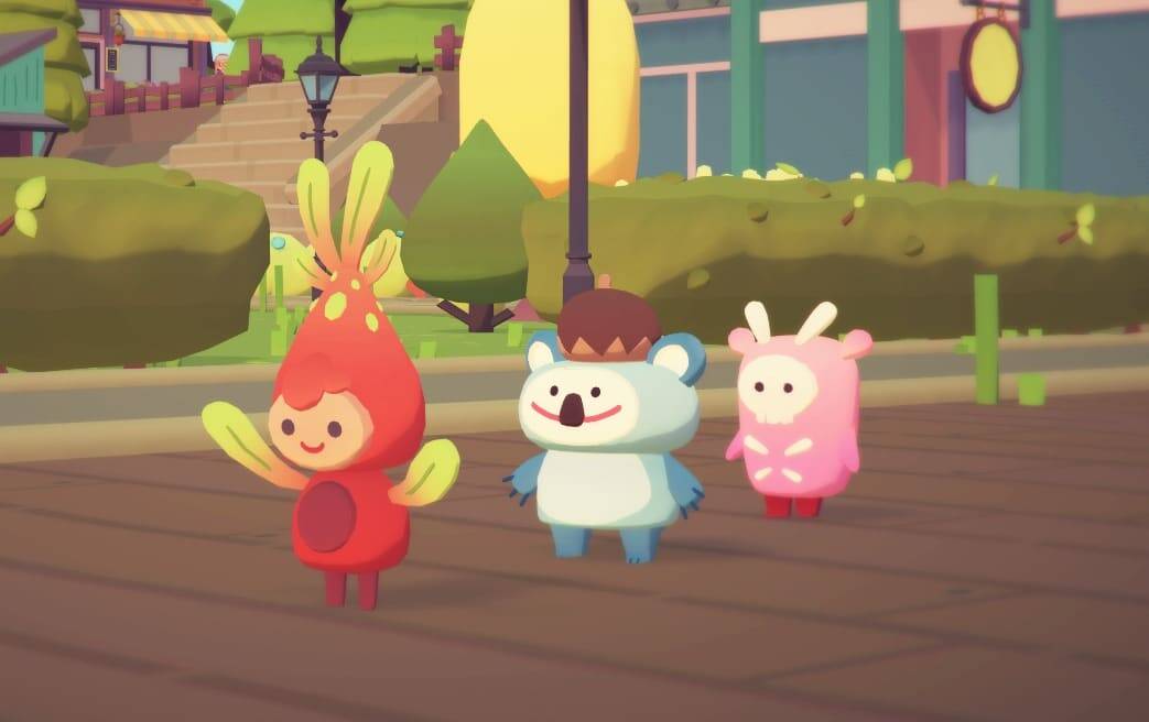Three colourful animated characters stand on a wooden floor in a bright outdoor setting with stairs and buildings in the background