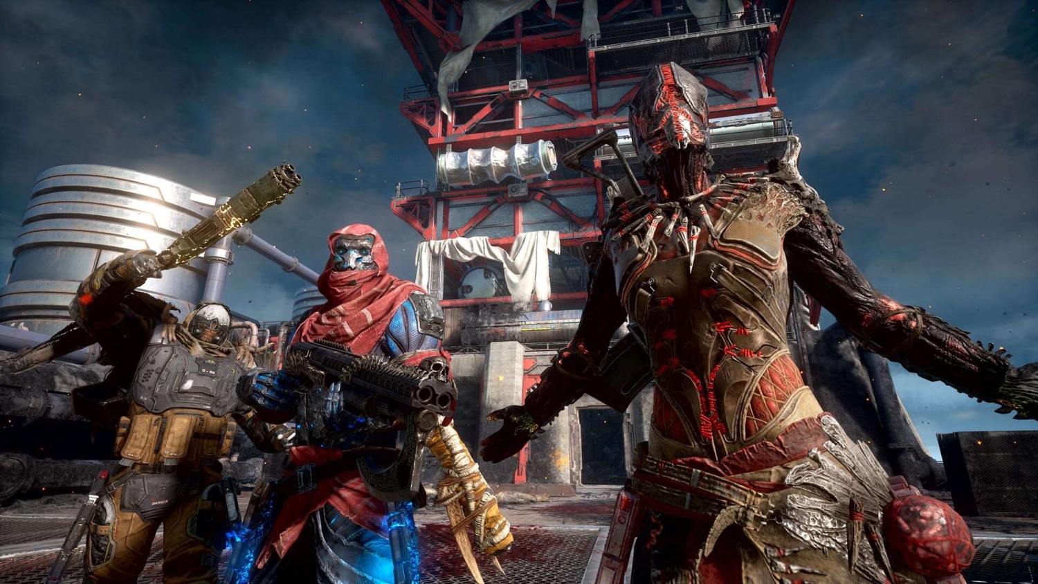 Three armed characters in detailed futuristic armour stand on a platform beneath a steel structure against a dark cloudy sky.