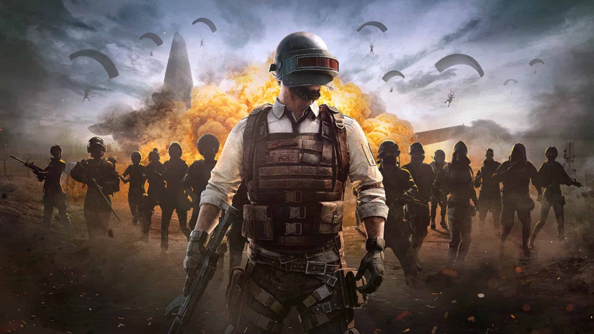 Armoured character with helmet and rifle in front of multiple characters and parachutes with explosion backdrop