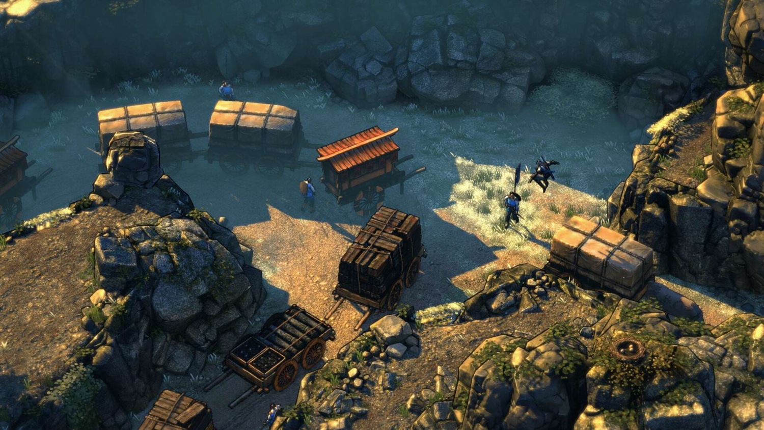 Top-down view showing armed soldiers and wooden carts positioned among rocky terrain in a tactical game