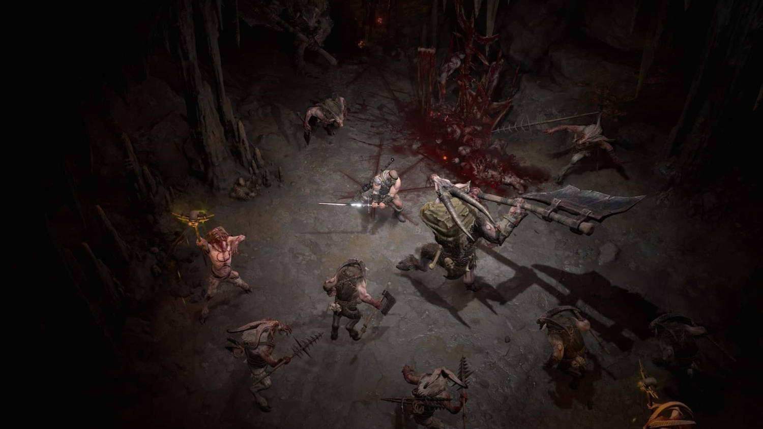Muscular warrior with a large sword surrounded by various grotesque demon monsters inside a dimly lit cave