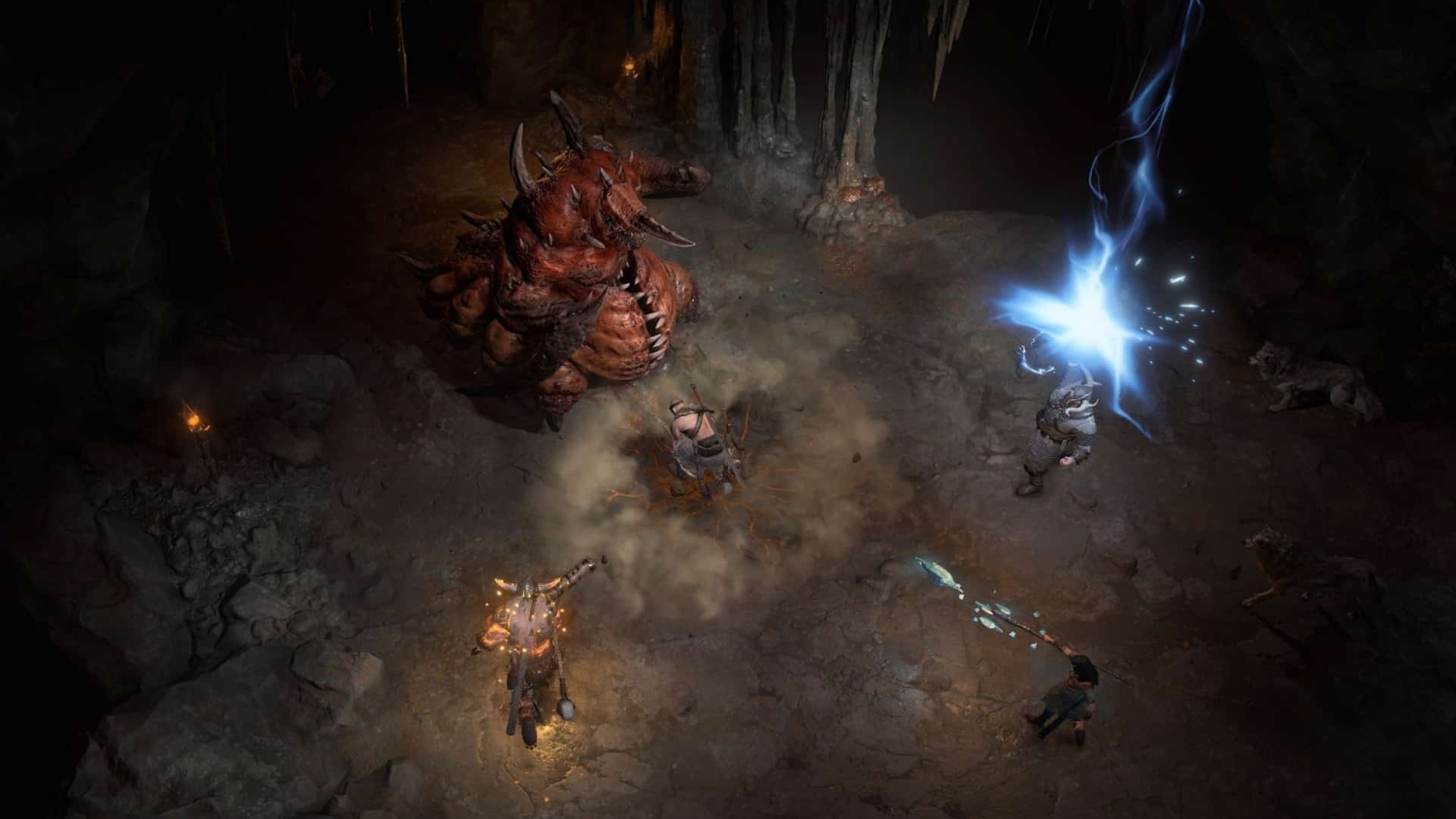 Four characters fighting a large horned demon in a dark cavern with magic and weapon attacks