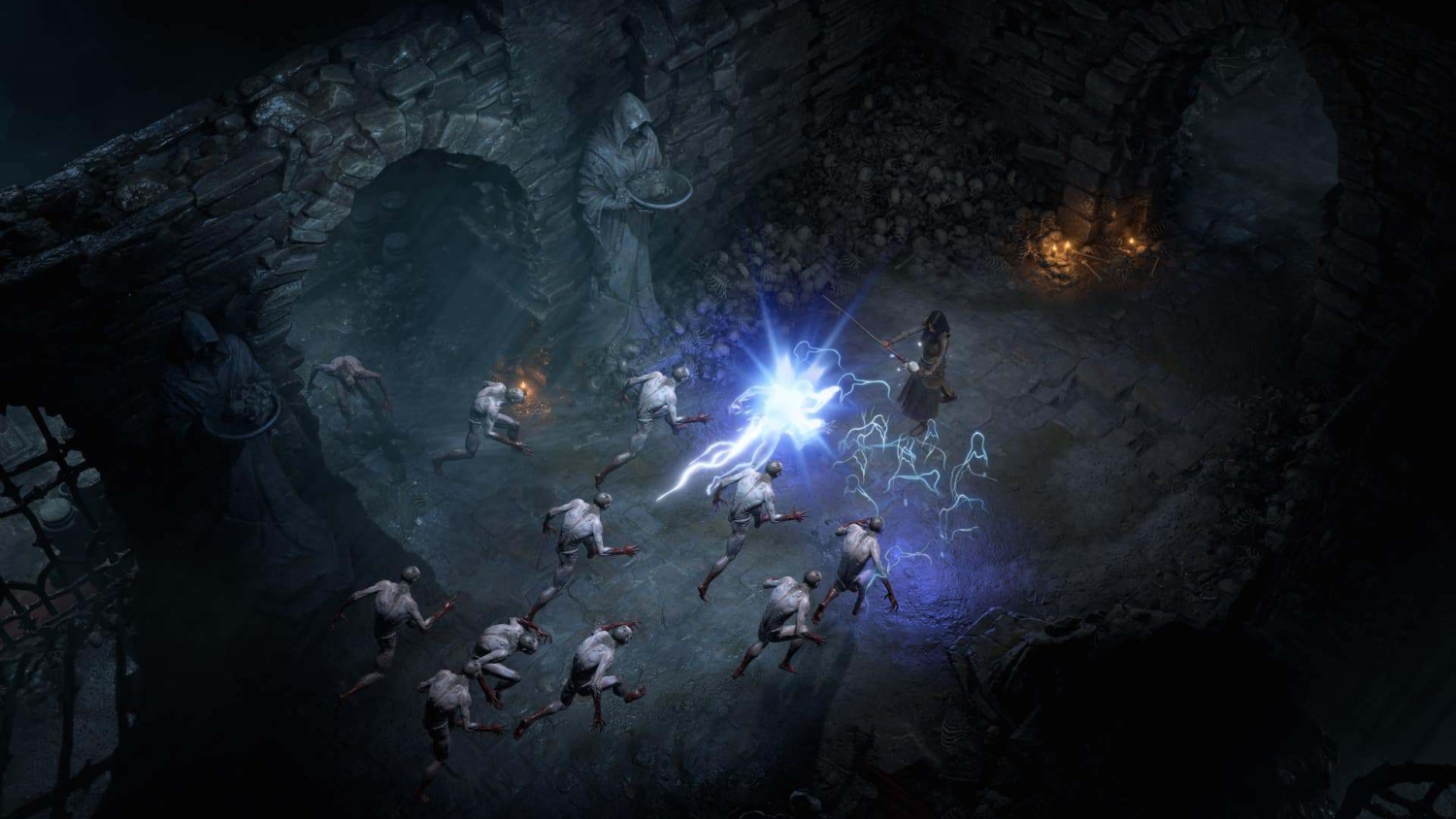 Hooded mage in dark stone cavern casting blue lightning spell at approaching pale monsters