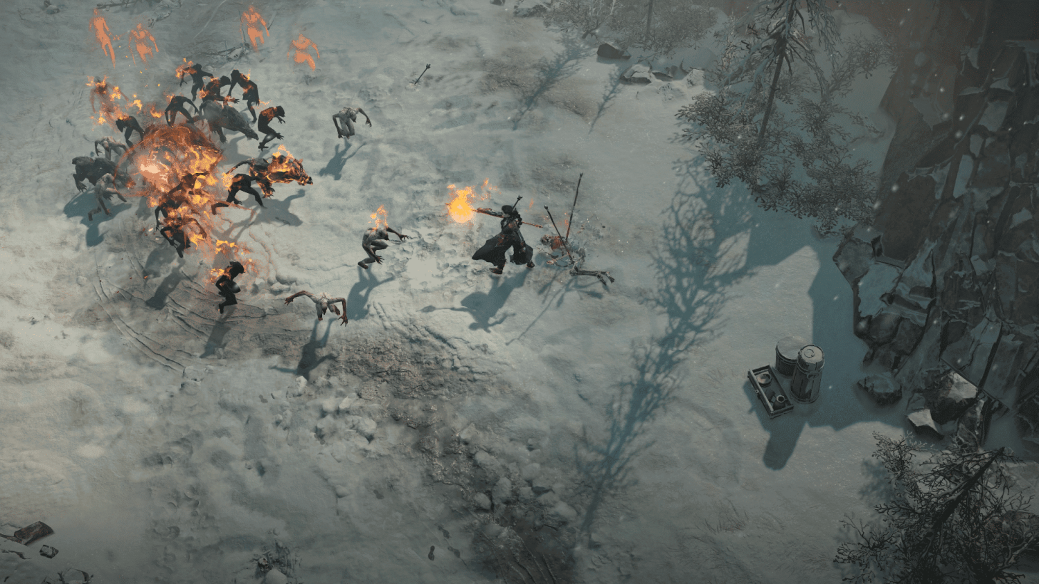 Game character casting fire magic at flaming attacking creatures in a snowy landscape