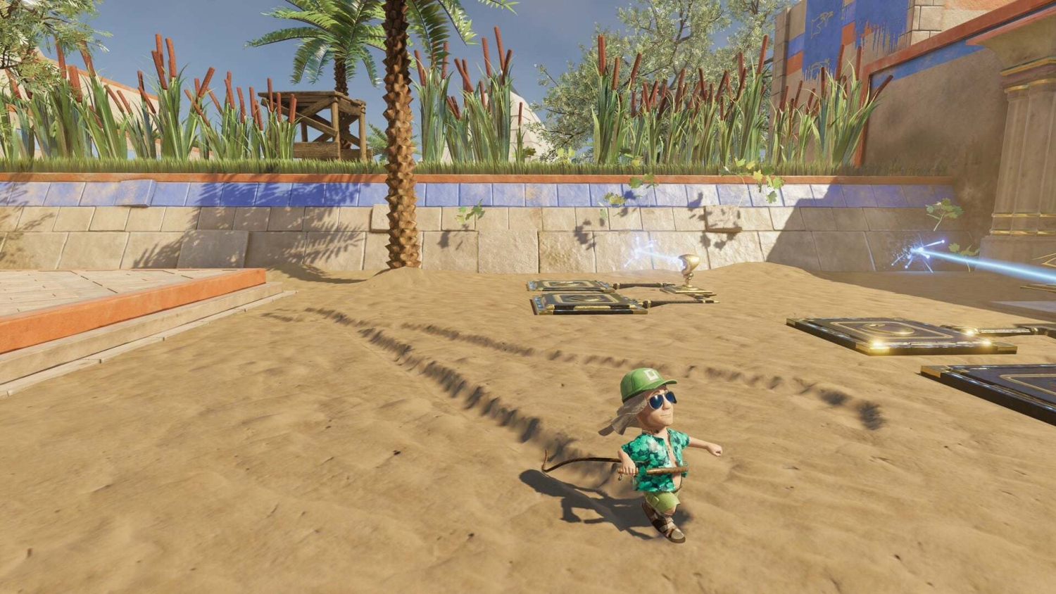 Small animated character in green outfit holding a stick in a sandy area with puzzle panels and palm trees