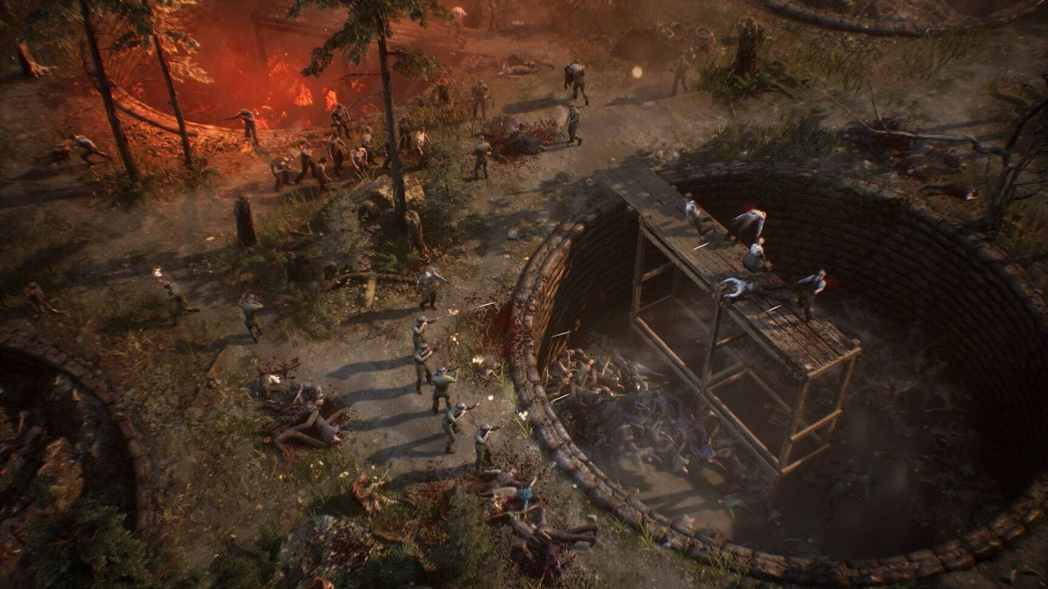 Soldiers in green uniforms shooting at zombies near a large circular pit filled with fallen zombies and a wooden structure inside