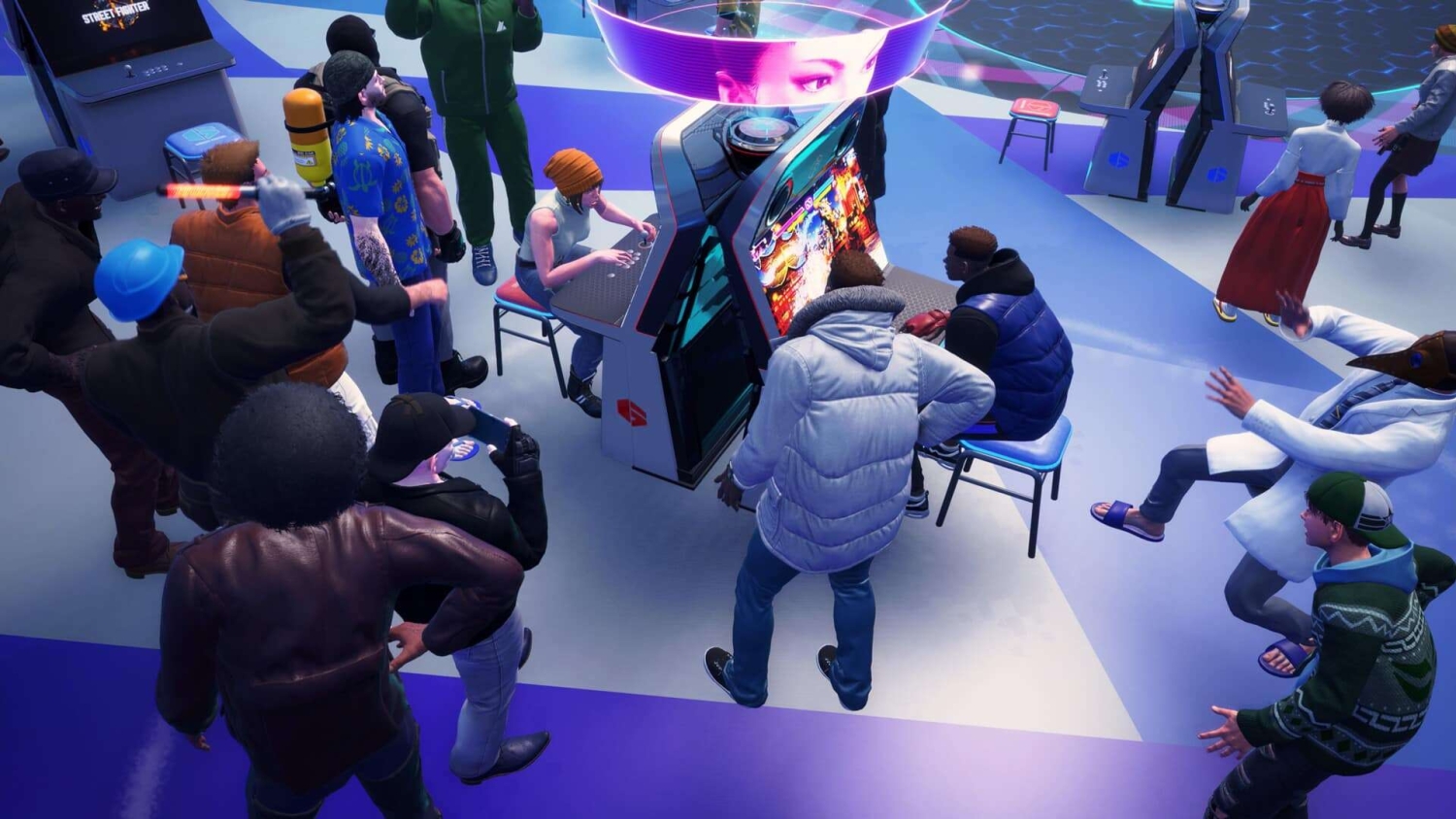Group of people gathered around two players competing on a Street Fighter arcade machine indoors