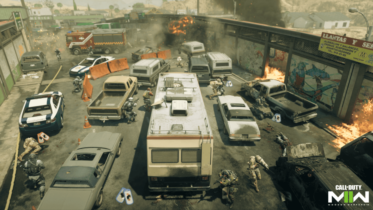 Soldiers advancing tactically through blocked urban street with burning vehicles and explosions