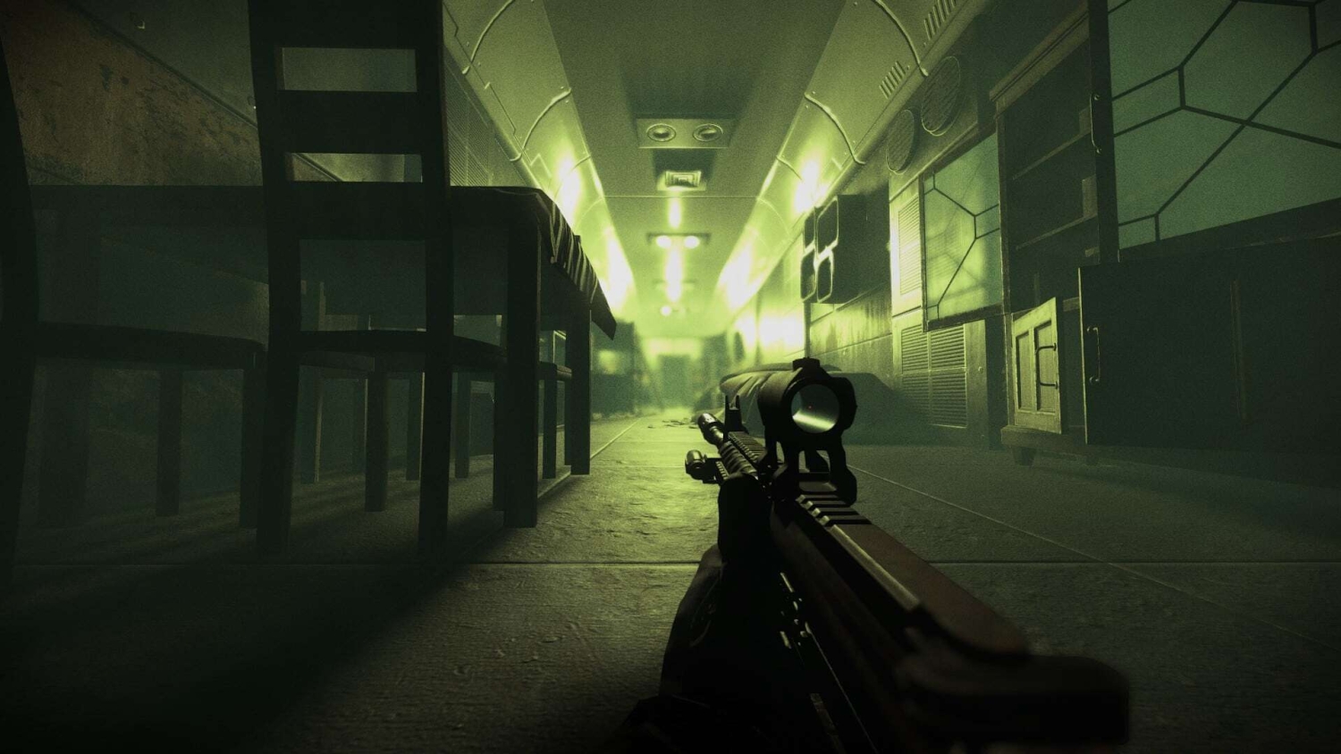 First-person view aiming with a scoped rifle down a dimly lit corridor beneath tables