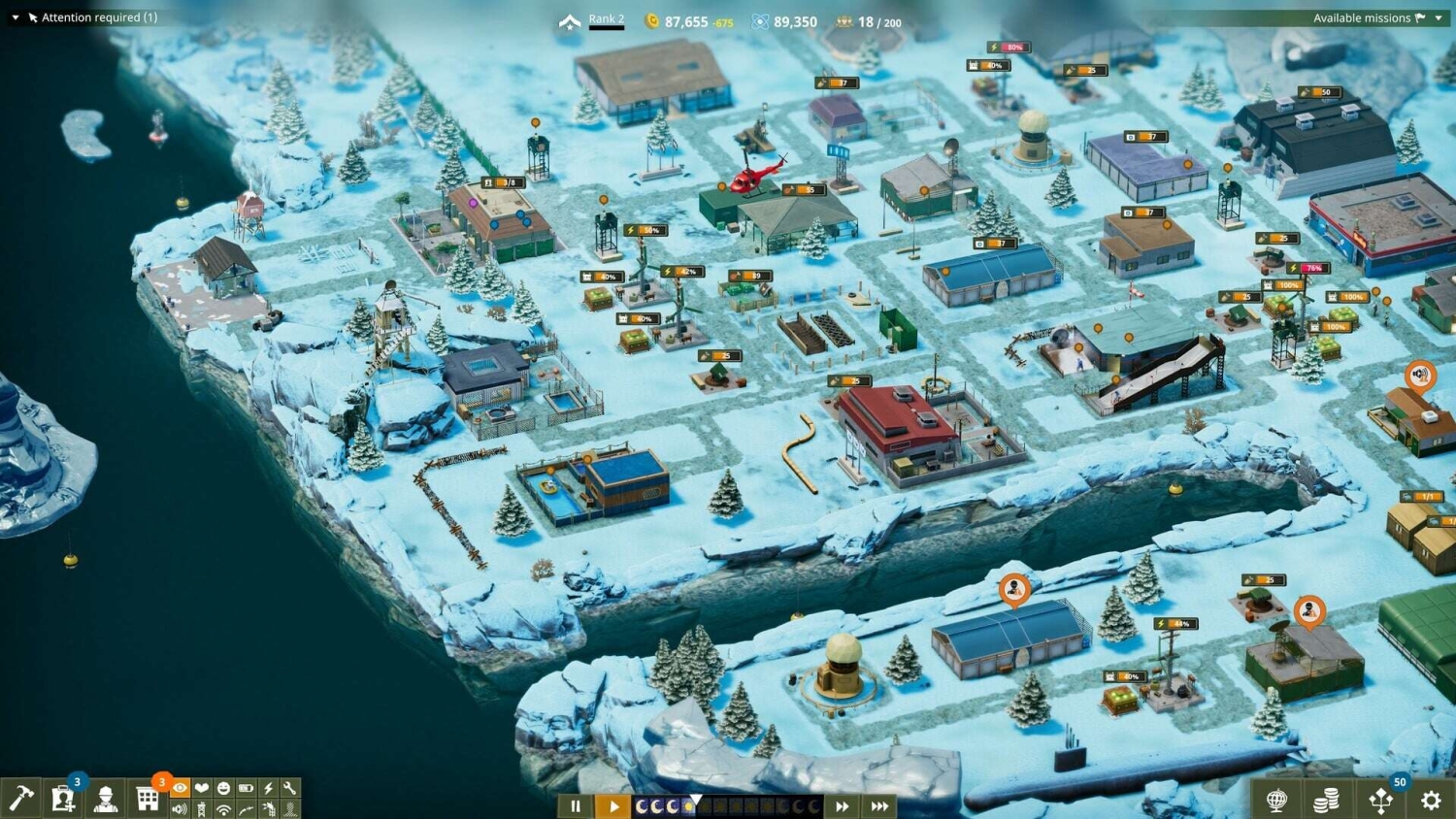 Top-down view of a snow-covered military camp with various buildings, roads and operational icons on a frosty island