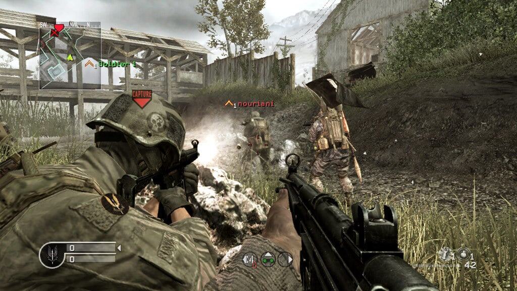 First-person view of a soldier aiming rifle at two enemy soldiers near wooden fence in muddy terrain