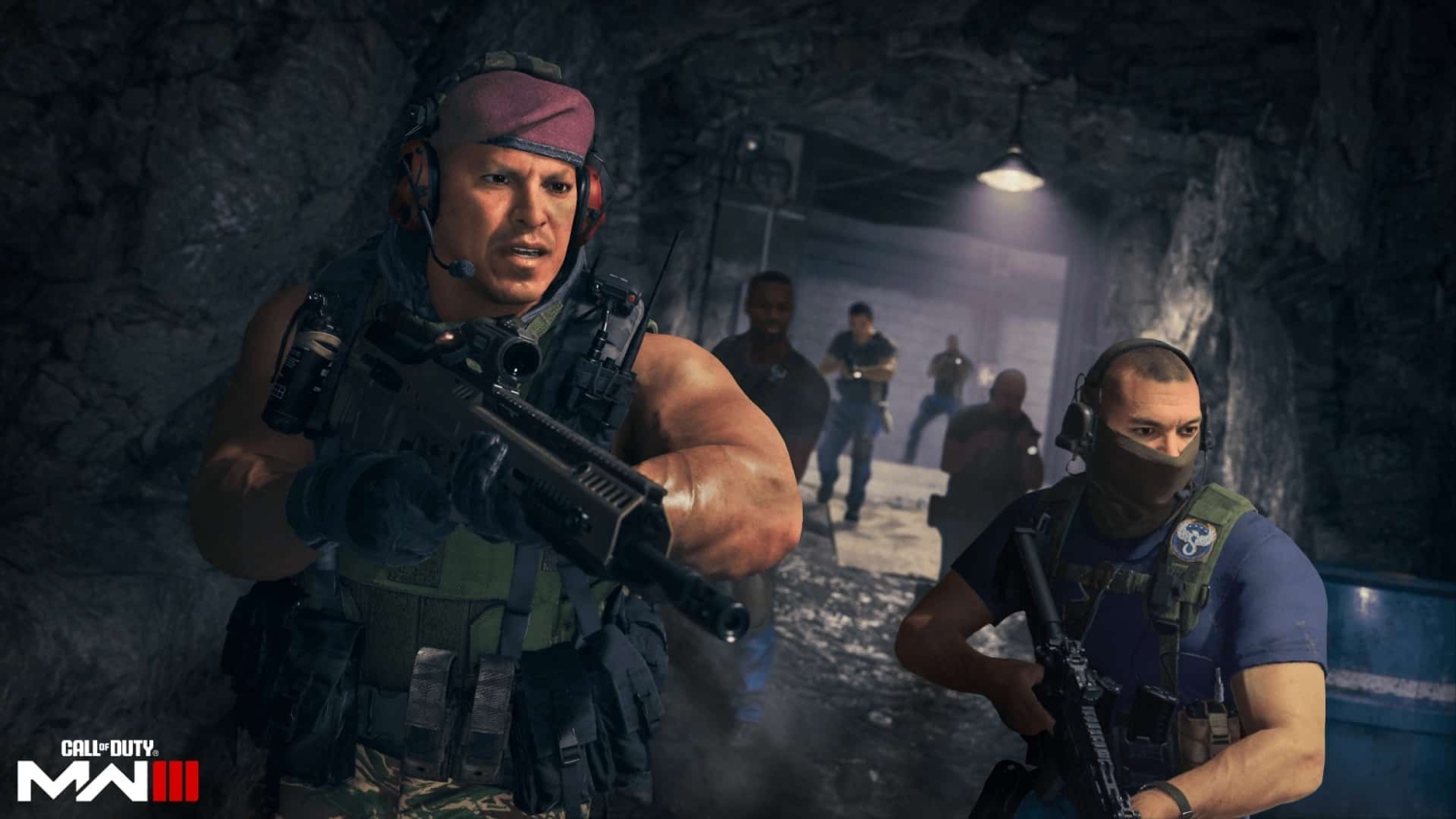 Two armed soldiers cautiously moving through a dimly lit underground tunnel in tactical gear