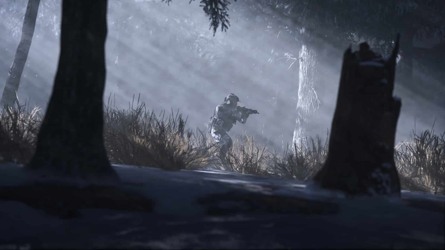 Camouflaged soldier aiming a rifle in a misty forest with sunlight filtering through trees