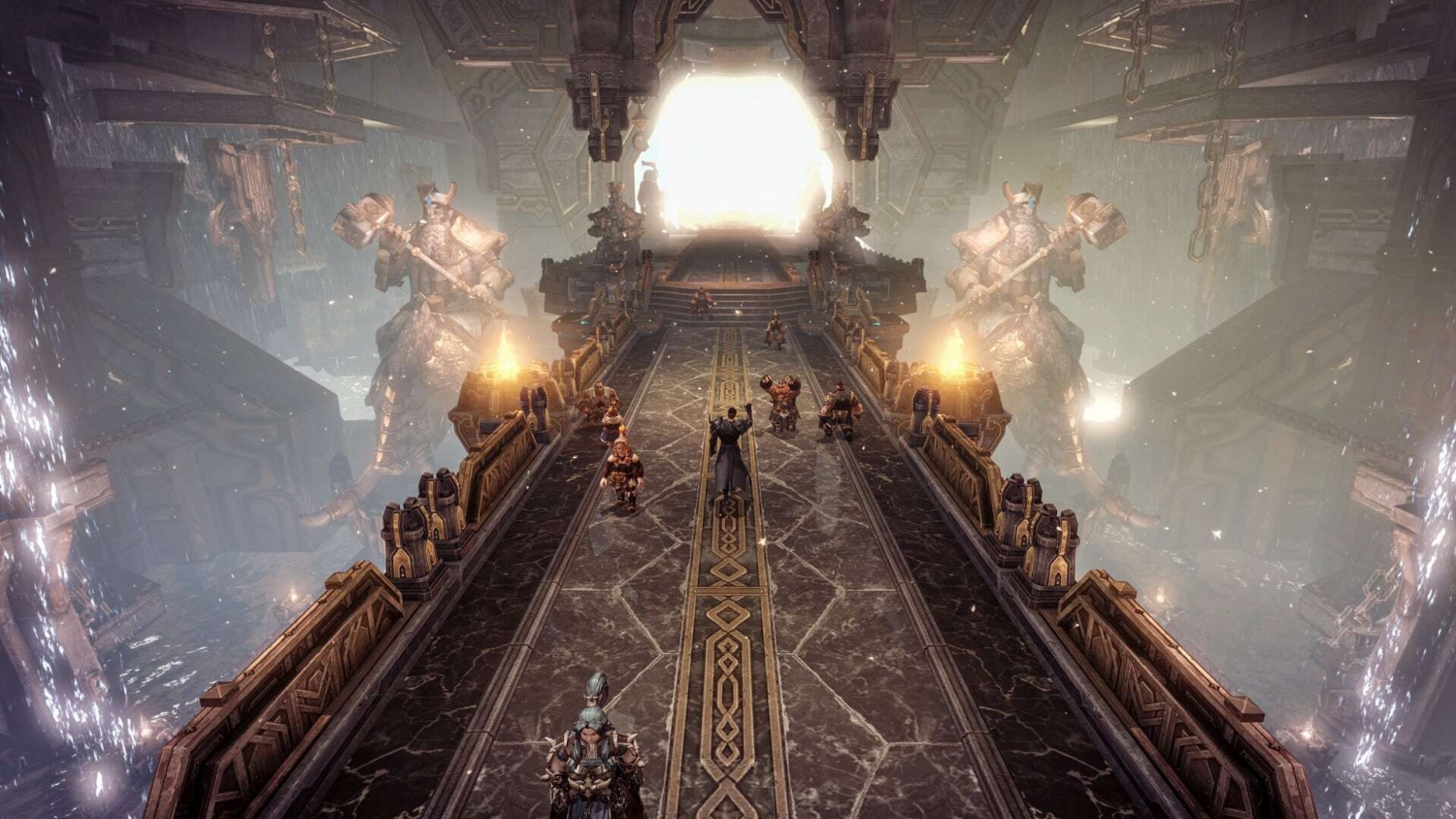 Characters cross a wide ornate stone bridge guarded by two massive hammer-wielding statues in a misty, mystical environment