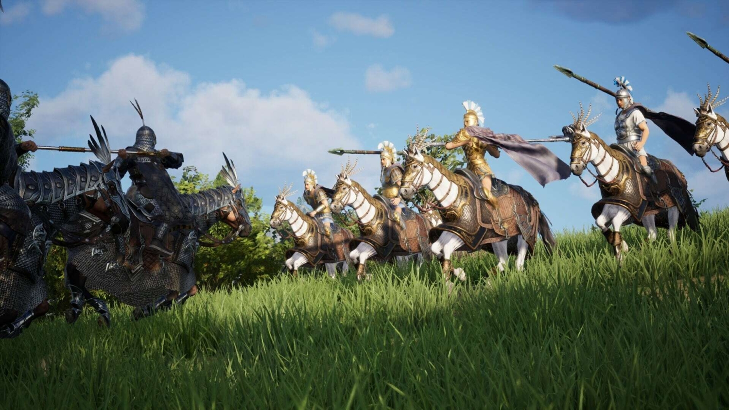Armoured medieval horsemen wielding spears and charging over a grassy hill under blue sky