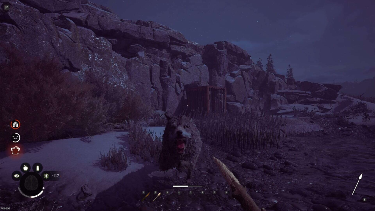 Hostile wolf growls aggressively at player holding spear near rocky cliff in a survival game at night