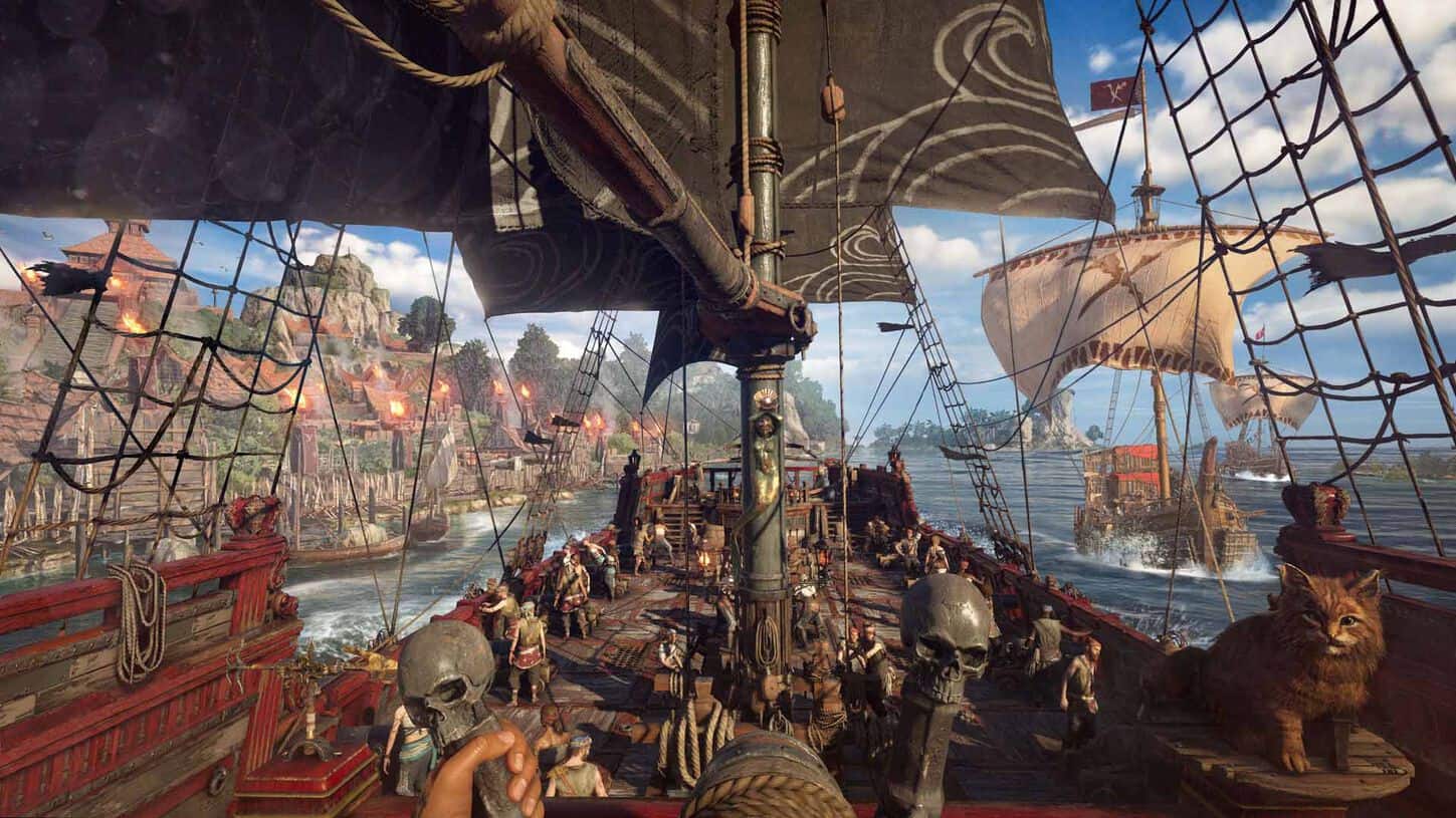 View from pirate ship deck with crew and skull-topped levers sailing toward coastal village under clear sky