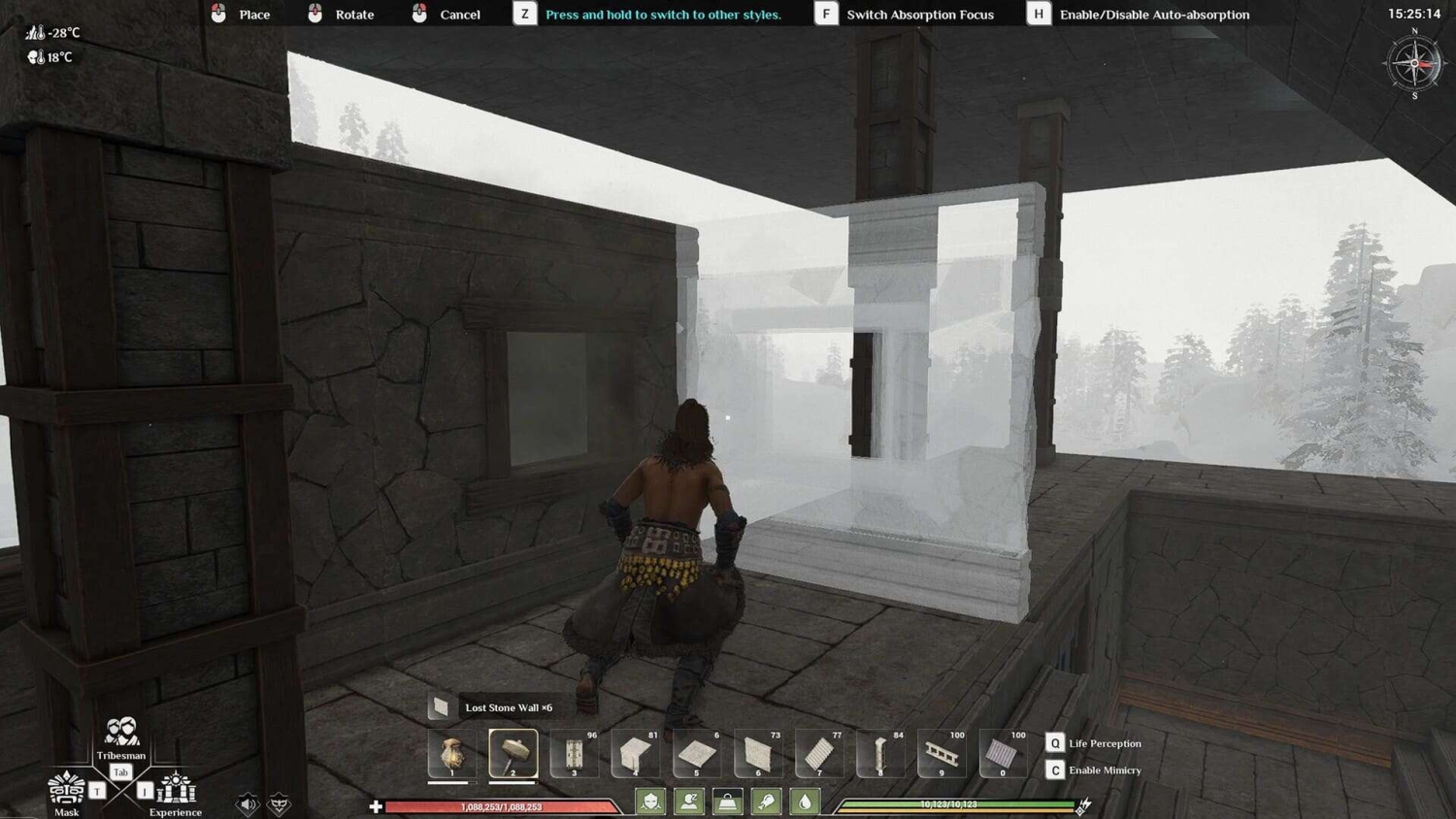 Player character crouching near a semi-transparent stone wall under construction inside a stone structure in a snowy environment