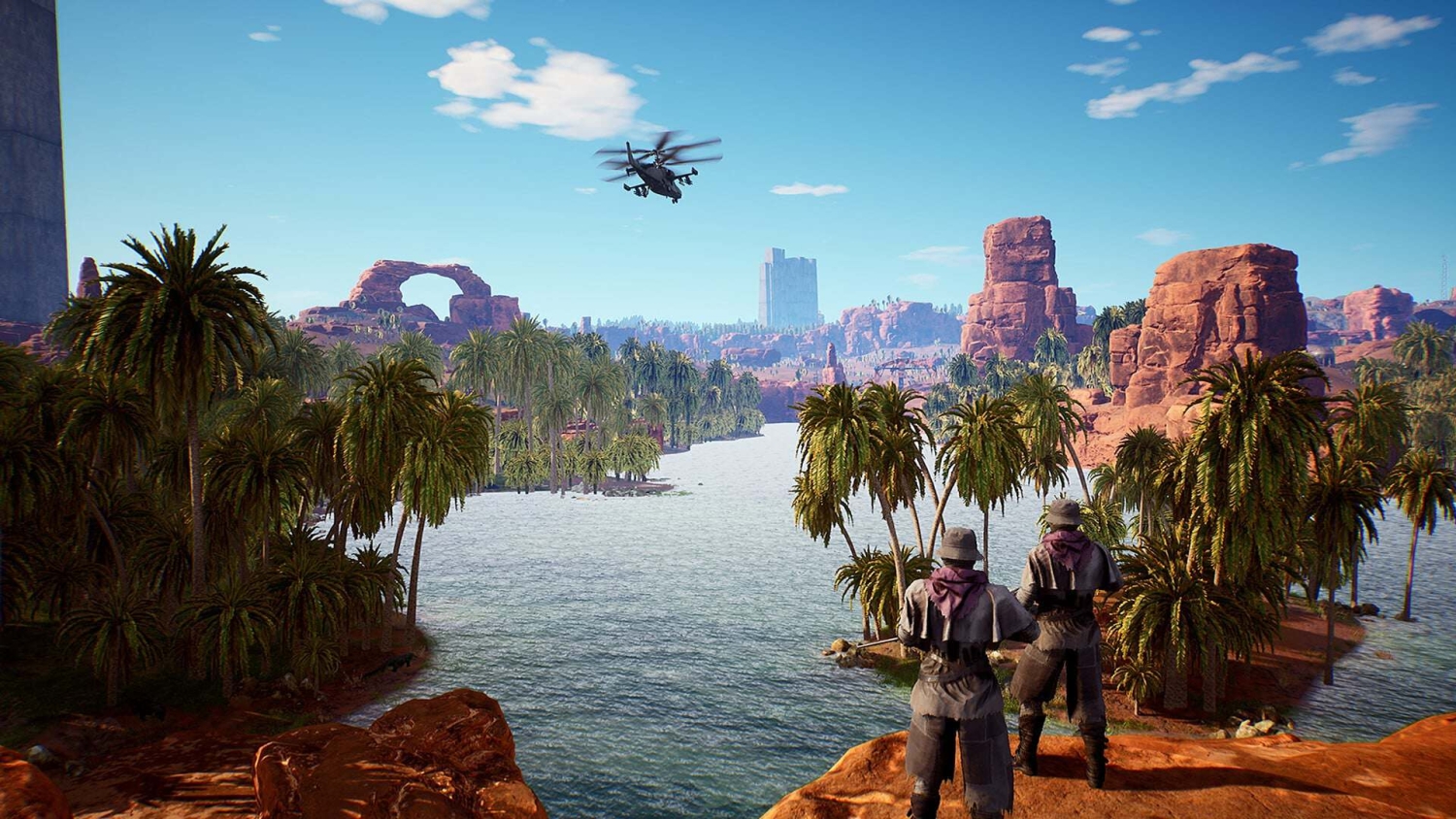 Two armed figures overlooking a palm-lined river in a desert with rocky formations and a military helicopter flying overhead